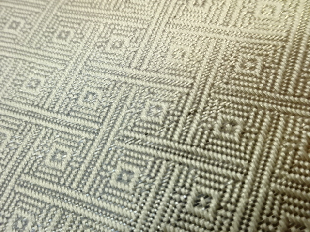  笹に蔓草・鶴・流水模様織出し袋帯